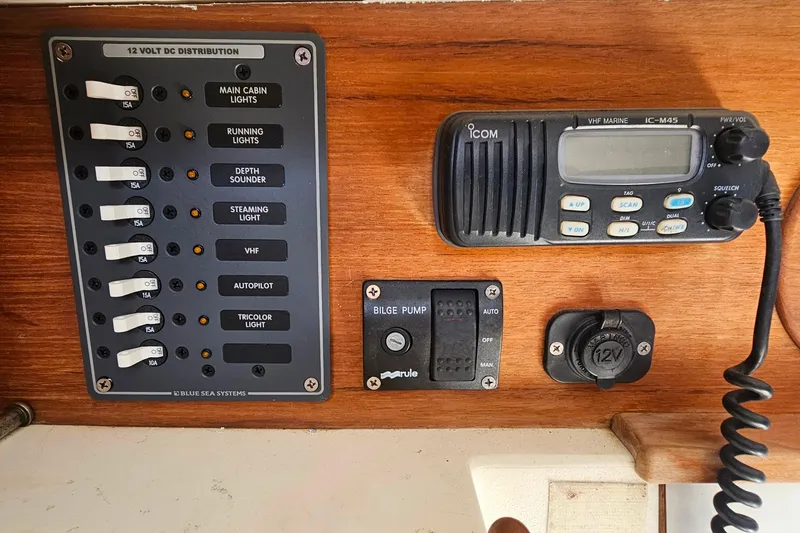 Slide: The Image of Control panel of a 2003 Herreshoff Alerion 26 sailboat with VHF radio and switches. - 9