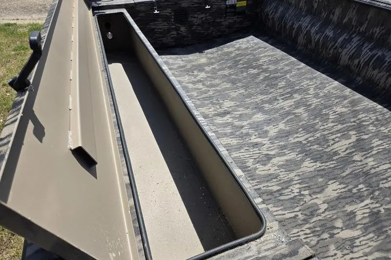 Slide: The Image of 2026 Havoc 1860 DBST boat interior with camouflage pattern and storage compartment. - 12