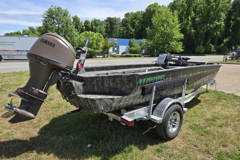 Slide: The Image of 2026 Havoc 1860 DBST boat with Yamaha motor on trailer, parked outdoors. - 4