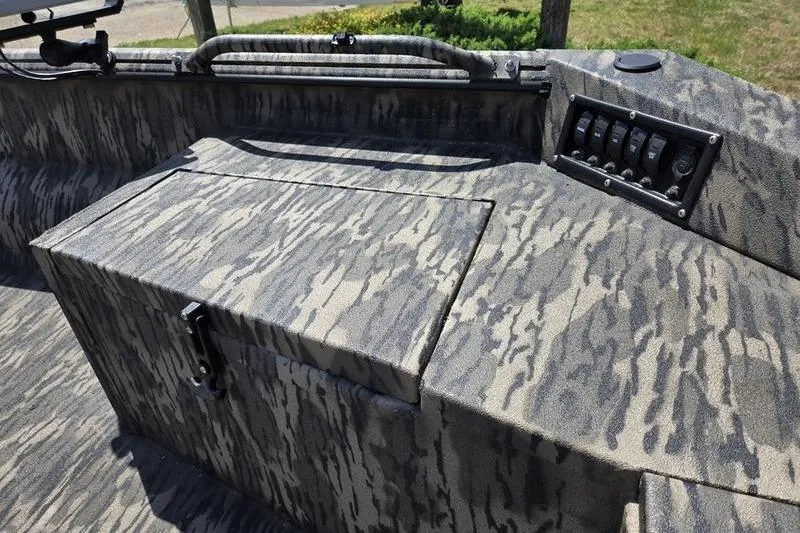 Slide: The Image of 2026 Havoc 1860 DBST boat interior with camouflage design and control panel. - 6
