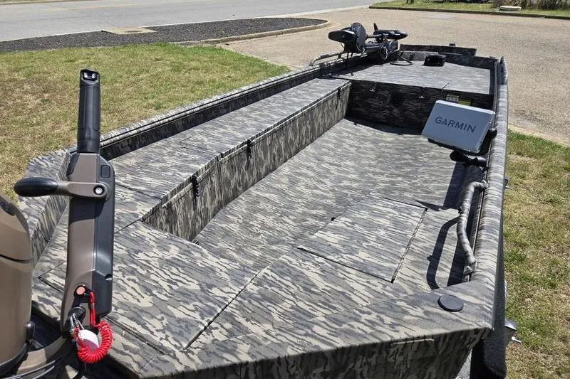 Slide: The Image of 2026 Havoc 1860 DBST boat with camouflage interior and Garmin navigation system. - 7