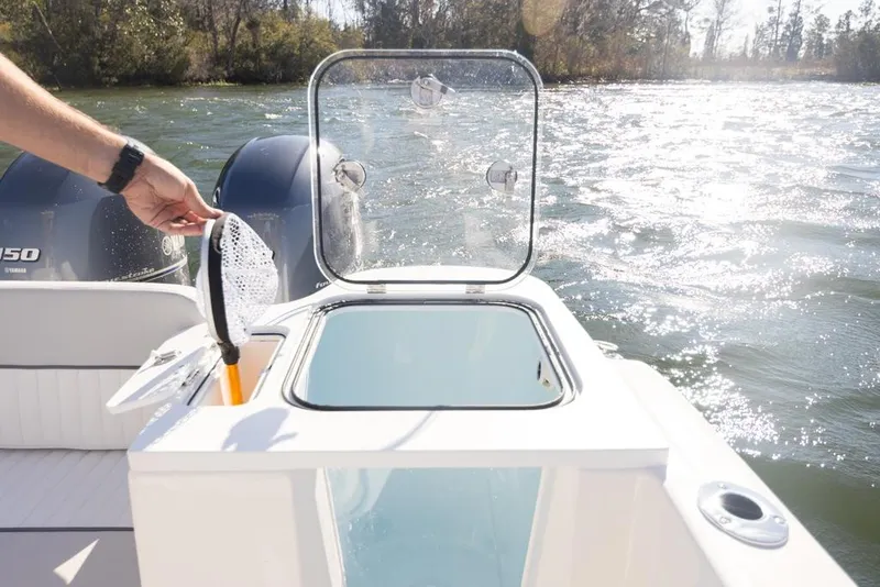 Slide: The Image of Manufacturer Provided Image: 2021 Sea Fox 268 Commander boat with open livewell and twin engines on a sunny day. - 22