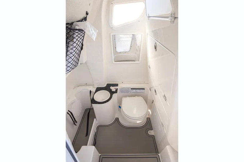 Slide: The Image of Manufacturer Provided Image: 2021 Sea Fox 268 Commander boat interior bathroom with toilet and sink. - 25