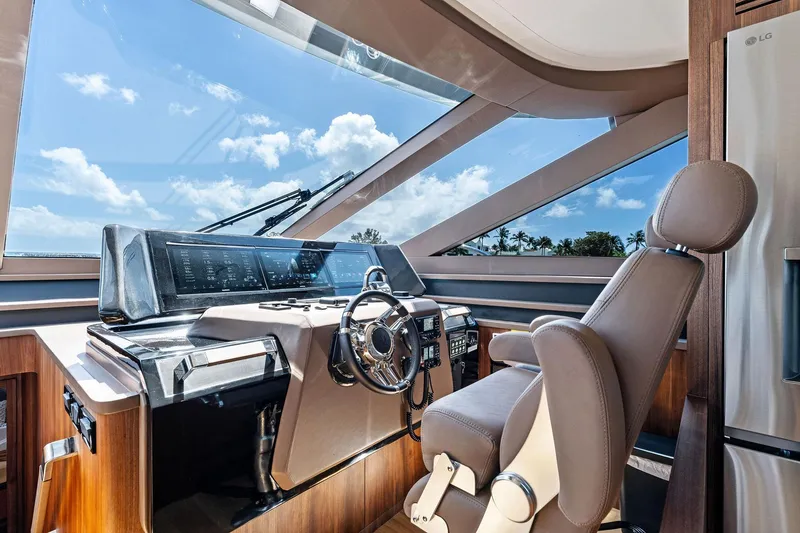 Slide: The Image of 2024 Aquitalia 78 Fly yacht cockpit with modern controls and panoramic windows. - 23