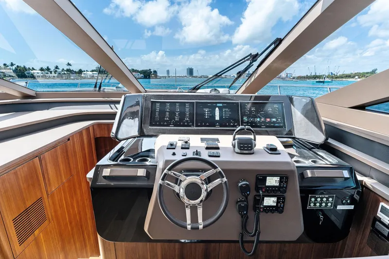Slide: The Image of 2024 Aquitalia 78 Fly yacht cockpit with modern controls and ocean view. - 25