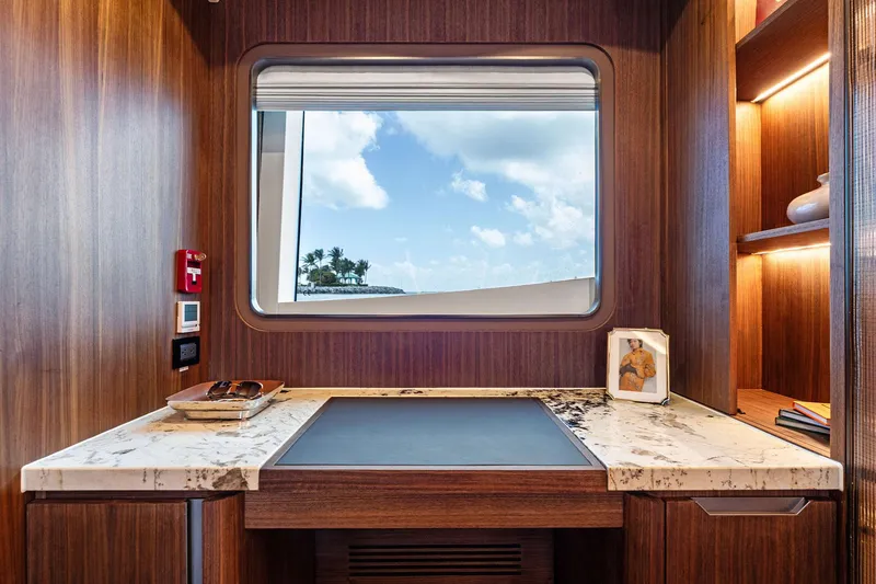 Slide: The Image of Luxurious interior of 2024 Aquitalia 78 Fly yacht with elegant wood finish and scenic window view. - 31