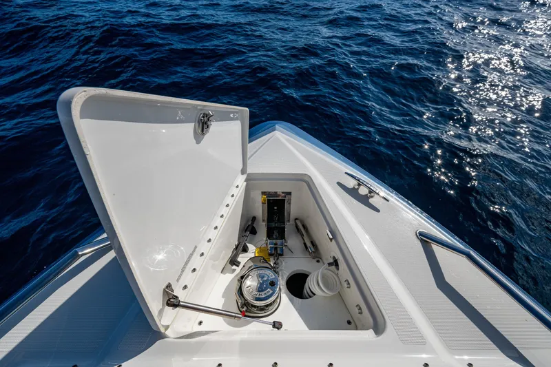 Slide: The Image of Open hatch on 2022 Formula 380 Super Sport Crossover OB, revealing anchor storage. - 23