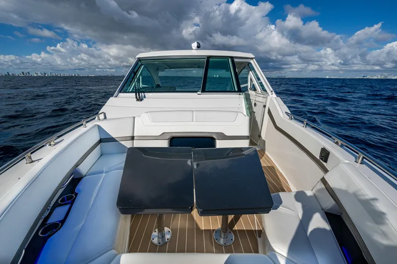 Slide: The Image of 2022 Formula 380 Super Sport Crossover OB on open sea under cloudy sky. - 24