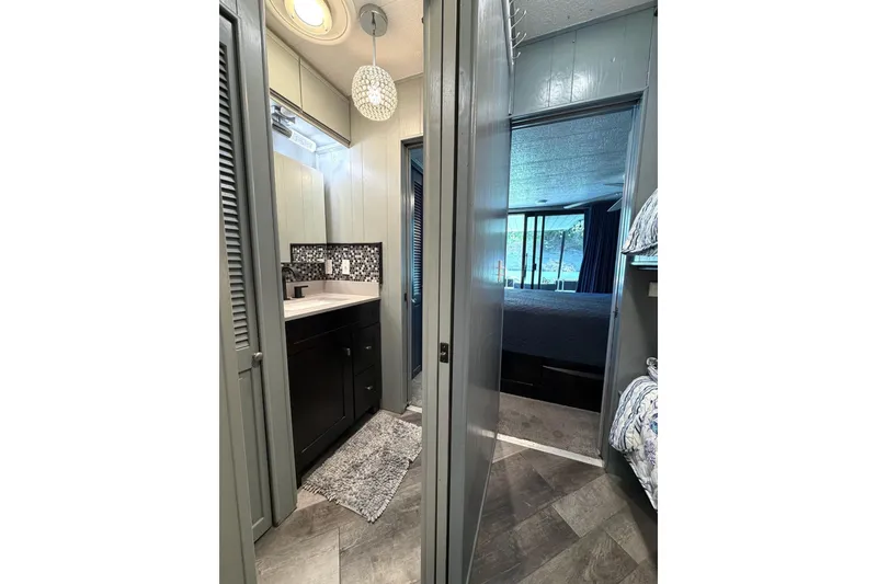 Slide: The Image of 1989 Sumerset 14x62 interior with modern bathroom and cozy bedroom view. - 23