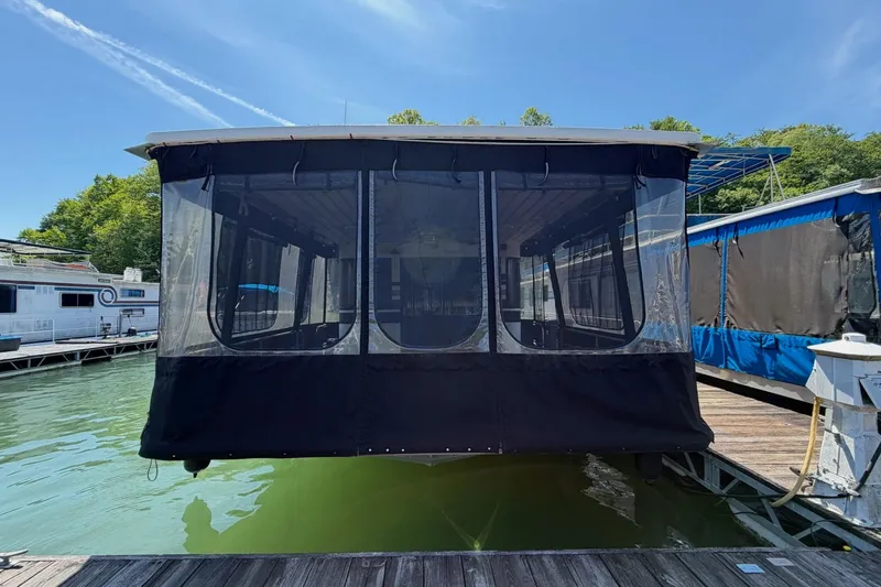 Slide: The Image of 1989 Sumerset 14x62 houseboat docked on a sunny day with clear skies. - 39