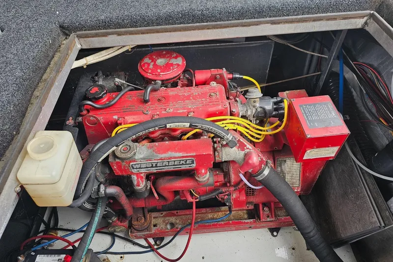 Slide: The Image of Engine compartment of a 1989 Sumerset 14x62 houseboat with Westerbeke generator. - 41