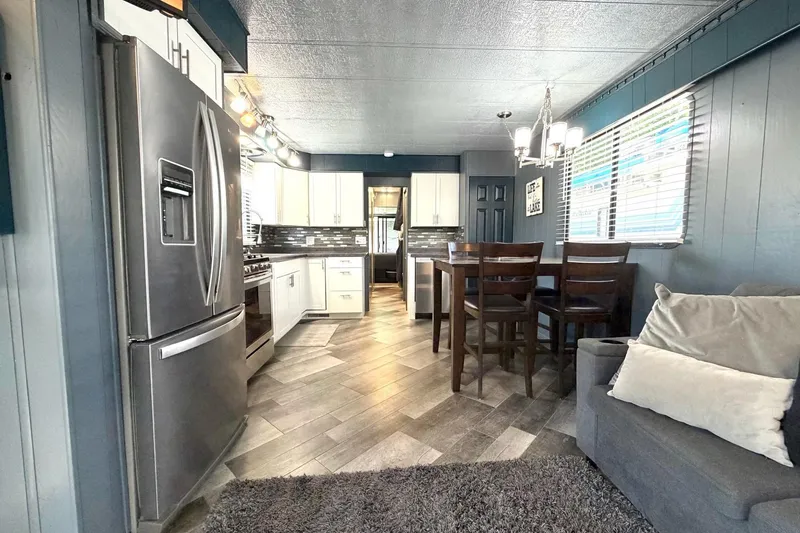 Slide: The Image of Modern kitchen and dining area in a 1989 Sumerset 14x62 houseboat. - 8