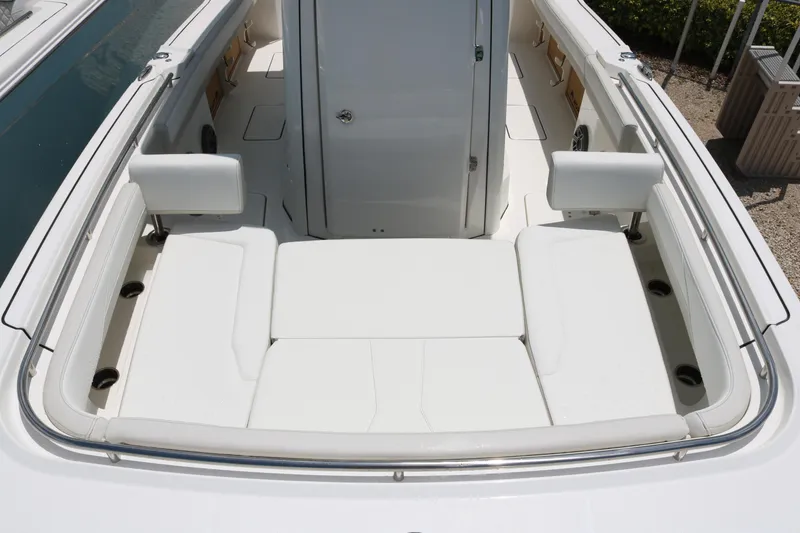 Slide: The Image of 2026 World Cat 265 CC-X boat interior with white seating and storage compartments. - 10