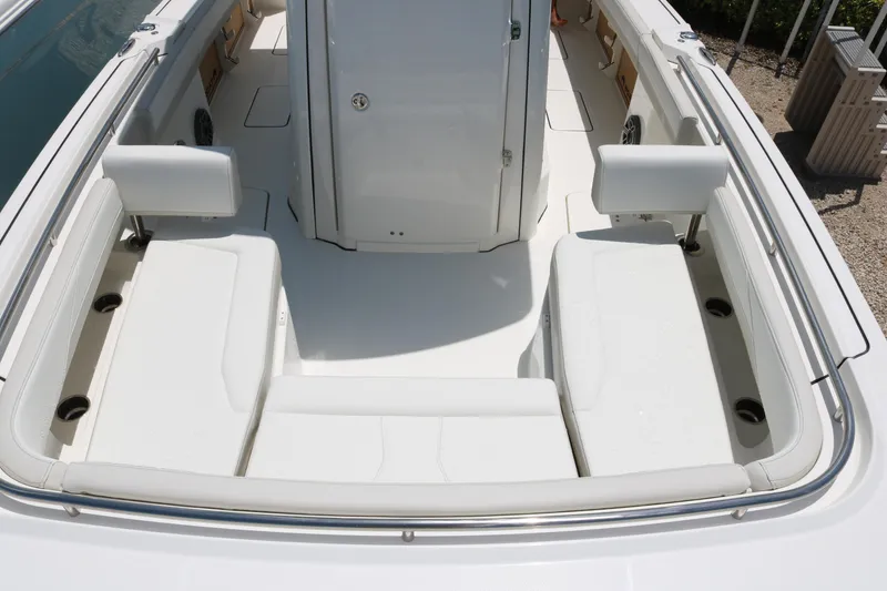 Slide: The Image of 2026 World Cat 265 CC-X boat interior with white seating and sleek design. - 11