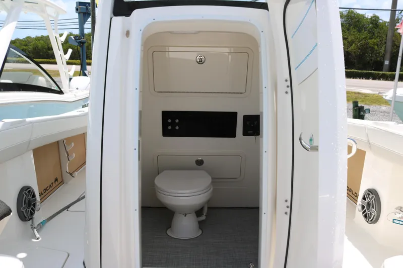 Slide: The Image of Interior view of 2026 World Cat 265 CC-X boat's compact bathroom. - 13