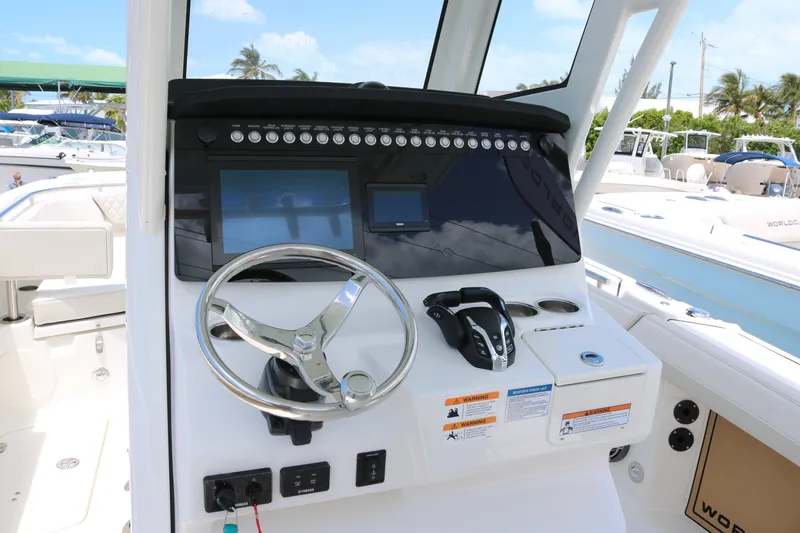 Slide: The Image of Helm of 2026 World Cat 265 CC-X boat with modern controls and steering wheel. - 14