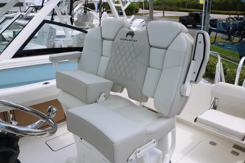 Slide: The Image of 2026 World Cat 265 CC-X boat interior with luxurious seating and steering wheel. - 15