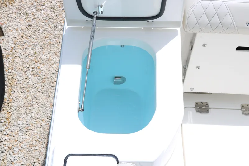 Slide: The Image of Livewell on 2026 World Cat 265 CC-X boat, open lid, blue water inside. - 17
