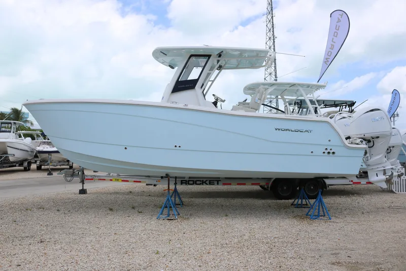 The Image of 2026 World Cat 265 CC-X boat on trailer, displayed outdoors. - 2