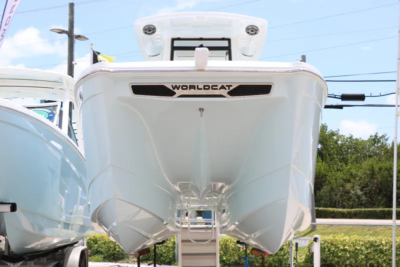 Slide: The Image of 2026 World Cat 265 CC-X boat displayed outdoors, showcasing sleek design and modern features. - 4