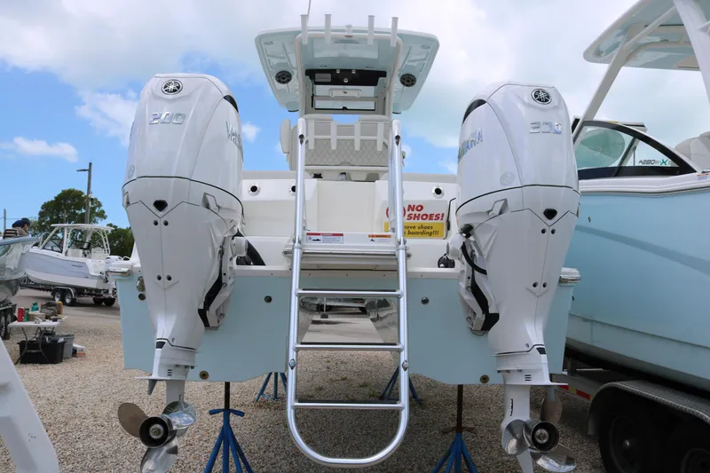 Slide: The Image of 2026 World Cat 265 CC-X boat with twin Yamaha 200 engines, rear view. - 6