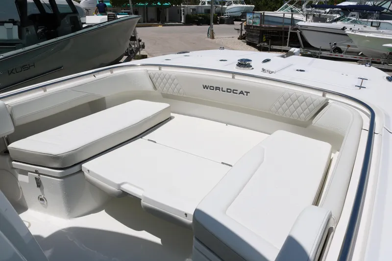 Slide: The Image of 2026 World Cat 265 CC-X boat interior with cushioned seating and sleek design. - 9