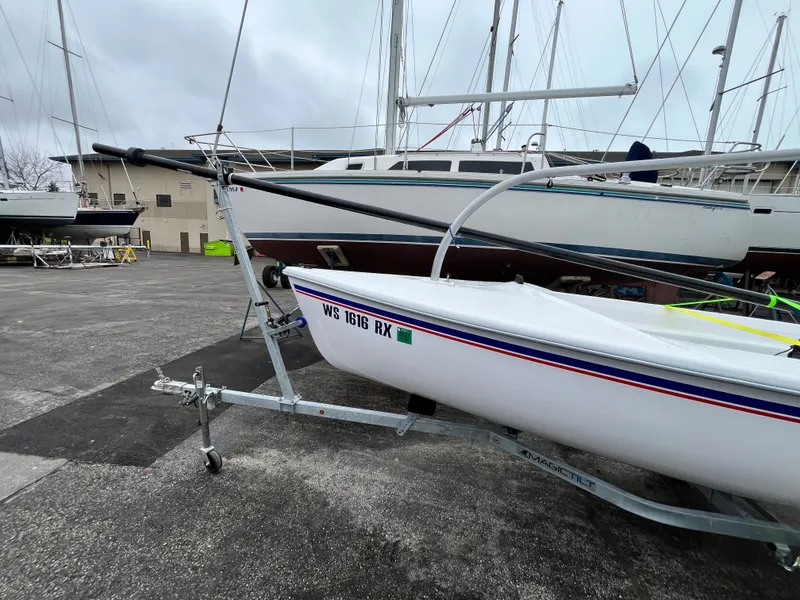 Slide: The Image of 2024 Catalina Expo 14.2 sailboat on a trailer at the marina. - 2