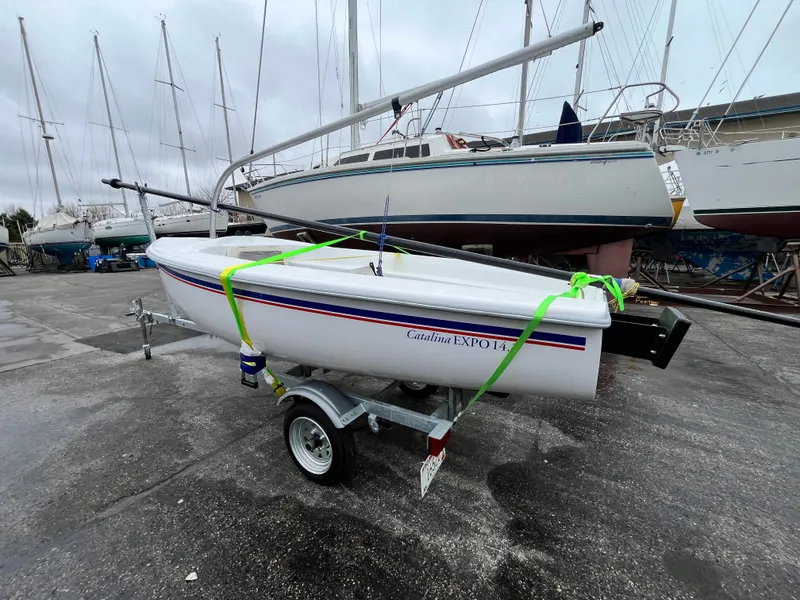 Slide: The Image of 2024 Catalina Expo 14.2 sailboat on trailer at marina. - 4