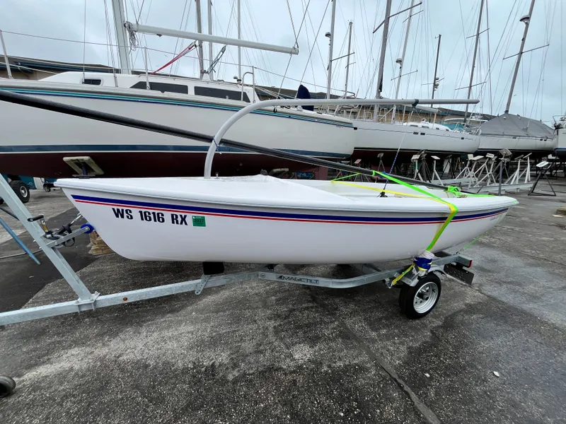 Slide: The Image of 2024 Catalina Expo 14.2 sailboat on trailer at marina. - 7
