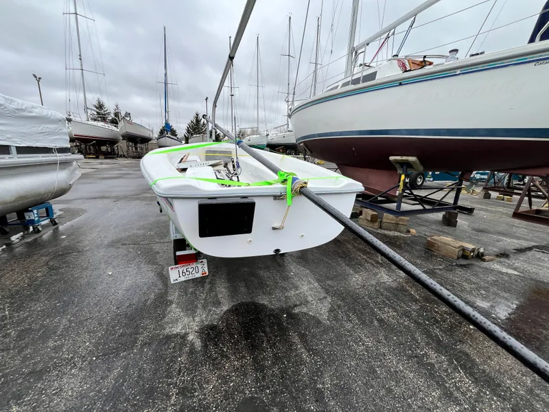 Slide: The Image of 2024 Catalina Expo 14.2 sailboat in harbor, rainy day. - 8