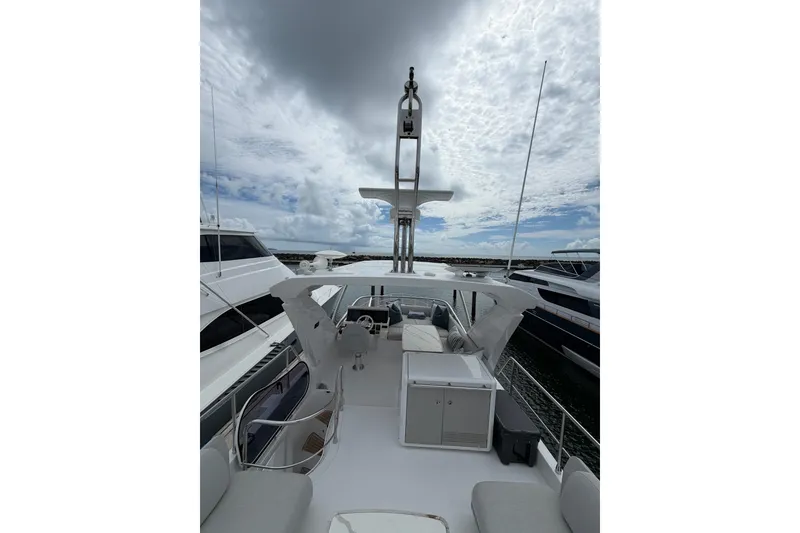 Slide: The Image of 2024 Azimut Fly 50 yacht with spacious deck under cloudy sky. - 18