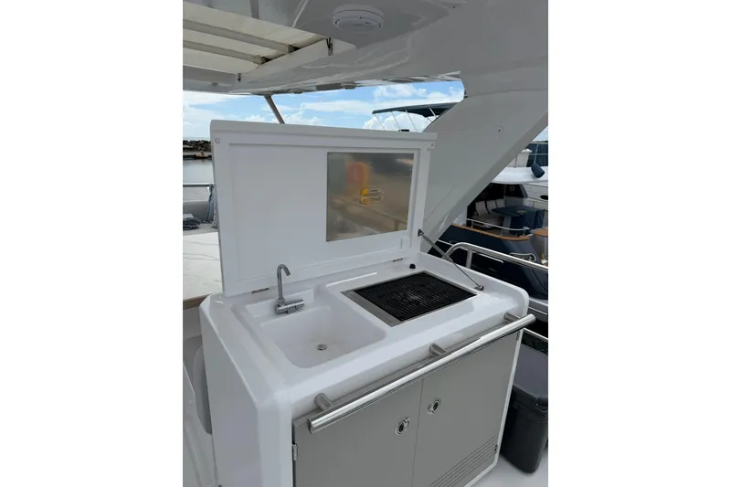 Slide: The Image of Outdoor kitchenette on 2024 Azimut Fly 50 yacht with sink and grill. - 19