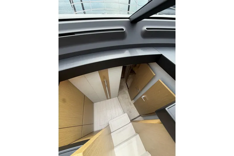 Slide: The Image of Interior view of 2024 Azimut Fly 50 yacht, featuring modern wood paneling and sleek design. - 21