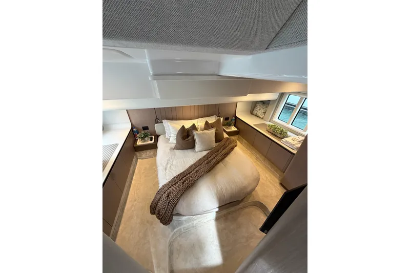 Slide: The Image of Luxurious bedroom interior of 2024 Azimut Fly 50 yacht with elegant decor and cozy bedding. - 22