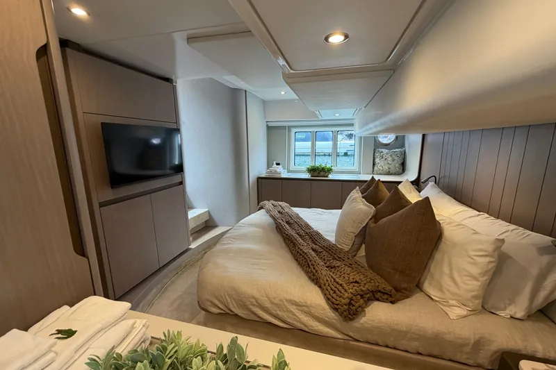 Slide: The Image of Luxurious bedroom interior of 2024 Azimut Fly 50 yacht with modern decor and cozy bedding. - 23