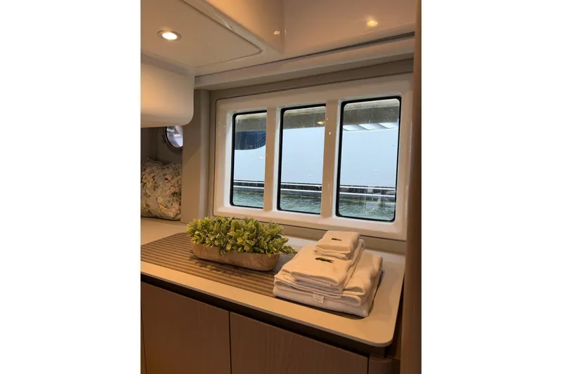 Slide: The Image of Luxurious interior of 2024 Azimut Fly 50 yacht with window view and elegant decor. - 25
