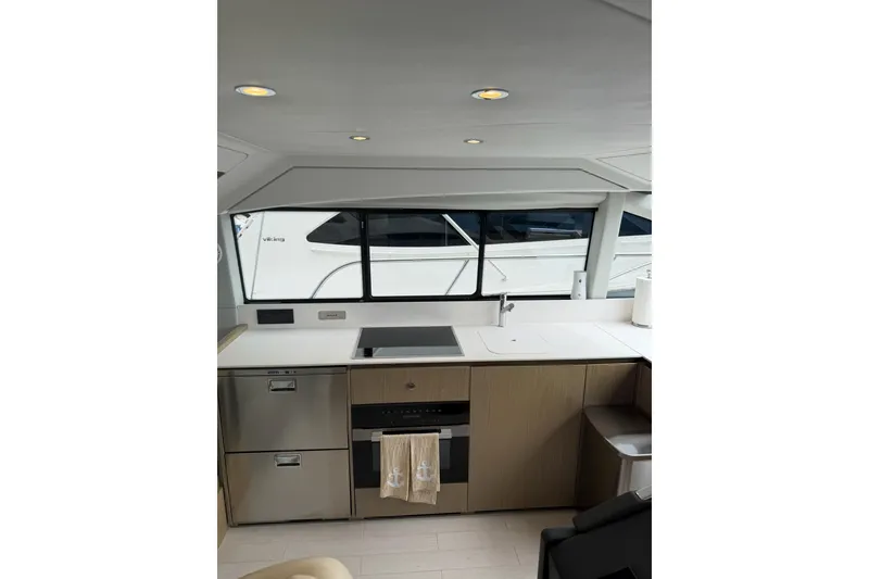 Slide: The Image of Modern kitchen interior of 2024 Azimut Fly 50 yacht, featuring sleek design and appliances. - 39
