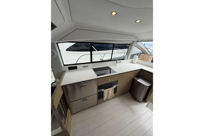 Slide: The Image of Modern kitchen interior of 2024 Azimut Fly 50 yacht, featuring sleek design and appliances. - 40
