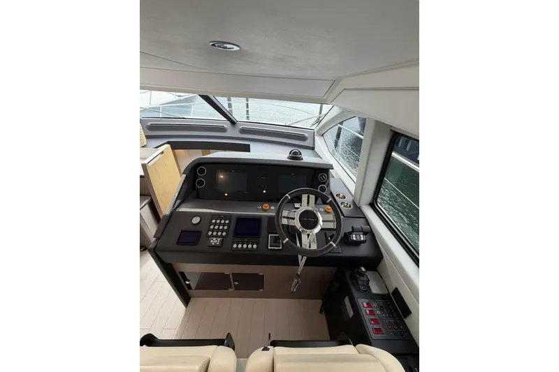 Slide: The Image of 2024 Azimut Fly 50 yacht helm with modern controls and sleek design. - 41