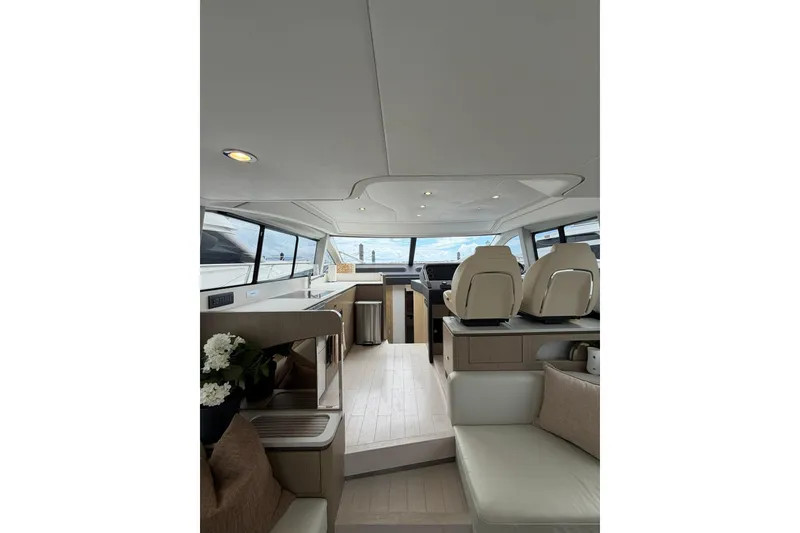 Slide: The Image of Luxurious interior of 2024 Azimut Fly 50 yacht with modern seating and panoramic windows. - 44