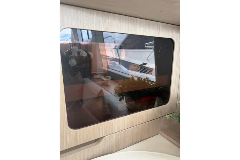 Slide: The Image of Reflection on Azimut Fly 50 yacht window, showcasing interior elegance, 2024 model. - 45