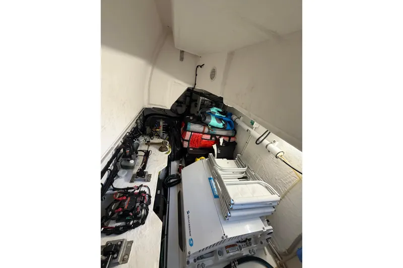 Slide: The Image of Engine room of 2024 Azimut Fly 50 yacht with equipment and storage. - 49