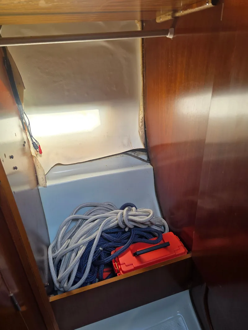Slide: The Image of Interior of a 1994 Beneteau First 265 yacht with ropes and box. - 17