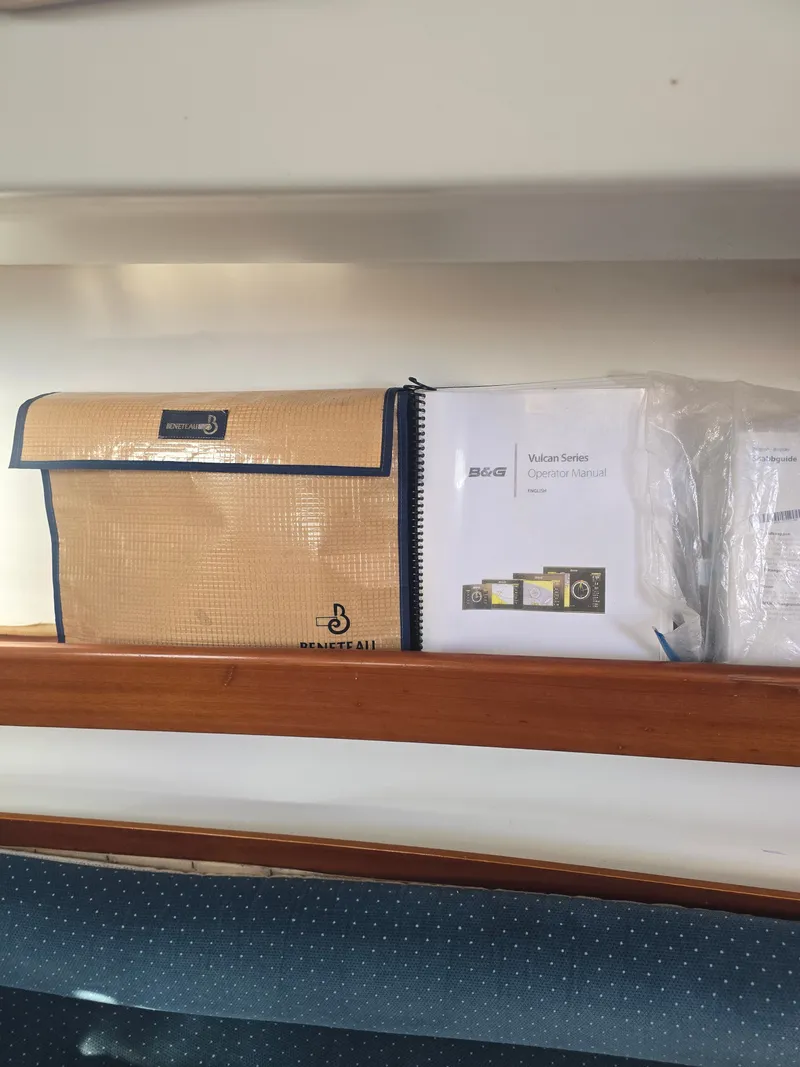 Slide: The Image of Beneteau First 265 1994 manual and bag on shelf. - 18