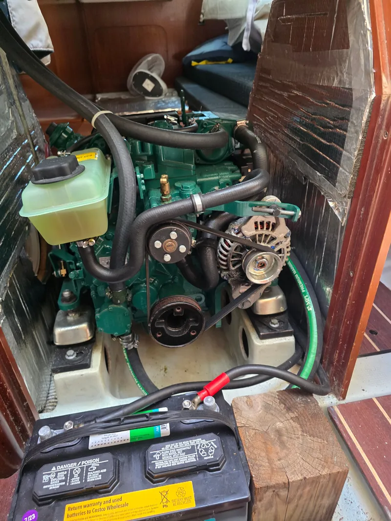 Slide: The Image of Engine compartment of a 1994 Beneteau First 265 with battery. - 21