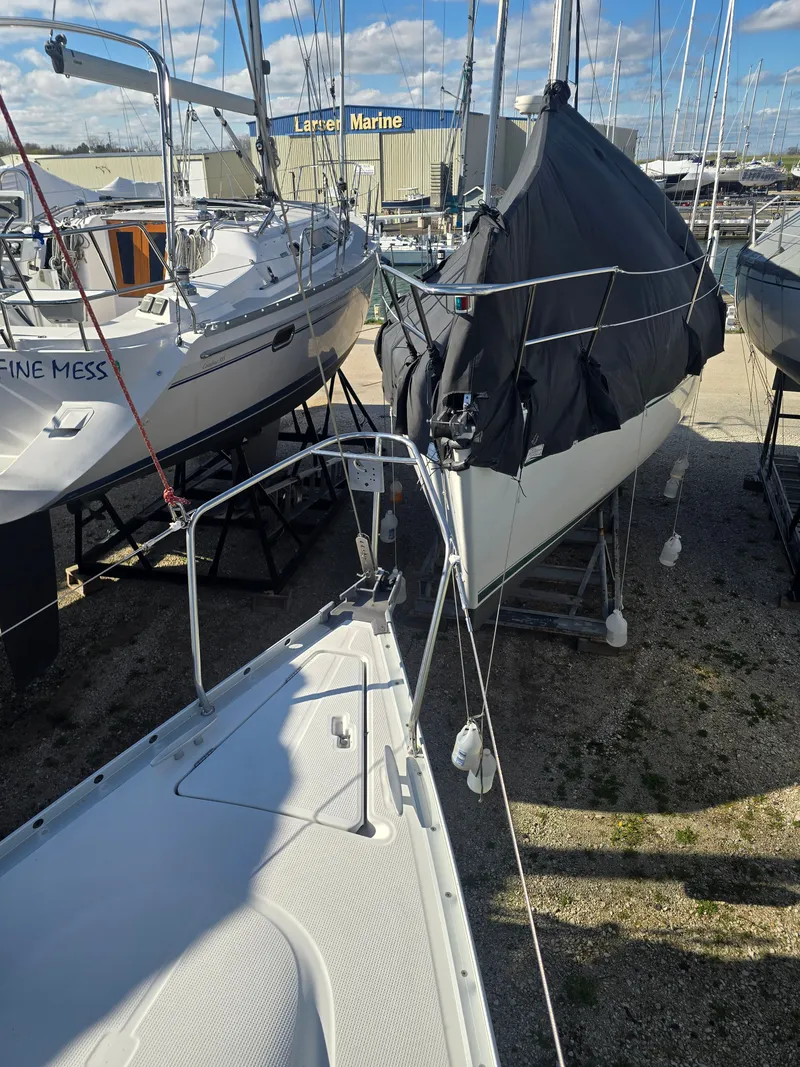 Slide: The Image of 1994 Beneteau First 265 sailboat in marina setting. - 24
