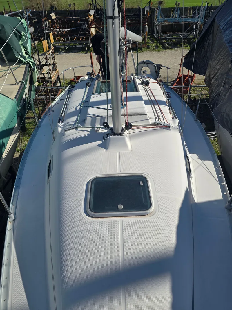 Slide: The Image of 1994 Beneteau First 265 sailboat on dry dock. - 25