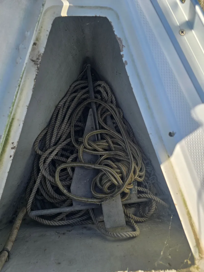 Slide: The Image of Anchor locker of a 1994 Beneteau First 265 with ropes. - 3
