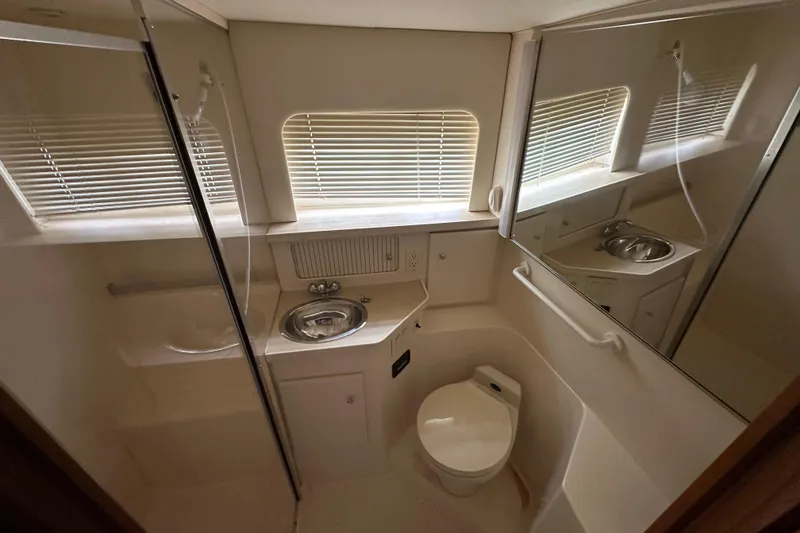 Slide: The Image of Bathroom interior of 1998 Carver 355 Aft Cabin Motor Yacht with sink and toilet. - 14
