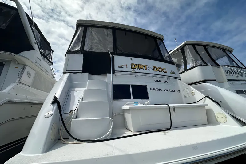 Slide: The Image of 1998 Carver 355 Aft Cabin Motor Yacht docked, featuring "Dirt Doc" nameplate, Grand Island, NY. - 3